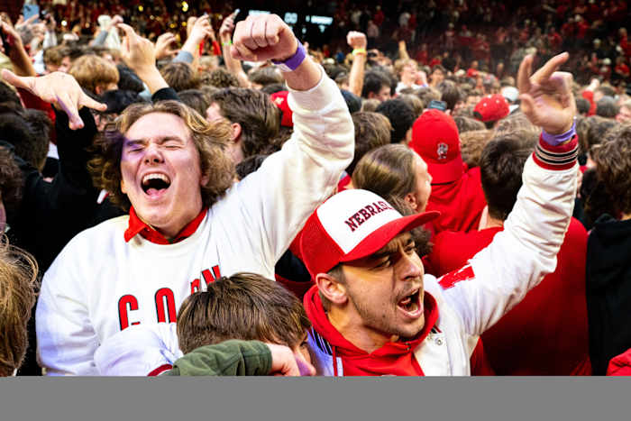 Feb 1, 2024; Lincoln, Nebraska, USA; Nebraska Cornhuskers fans storm the court after the Huskers defeated the Wisconsin Badgers at Pinnacle Bank Arena.